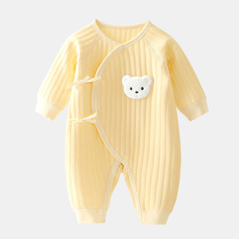 Close-up of soft, cozy infant bear romper fabric. Ideal for newborn comfort & warmth in spring/fall.