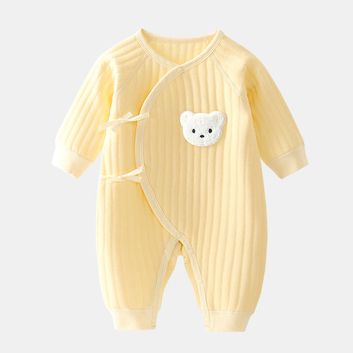 Close-up of soft, cozy infant bear romper fabric. Ideal for newborn comfort & warmth in spring/fall.