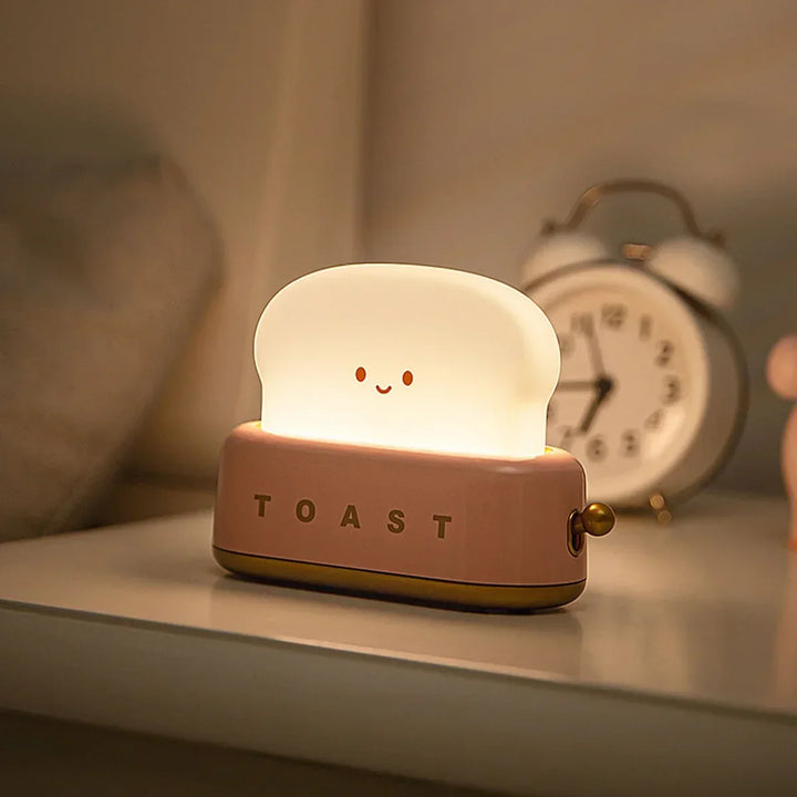 Cute ToastieGlow dimmable LED night light. Ideal rechargeable toast lamp for kids' rooms & bedroom decor. Warm light, USB-C.