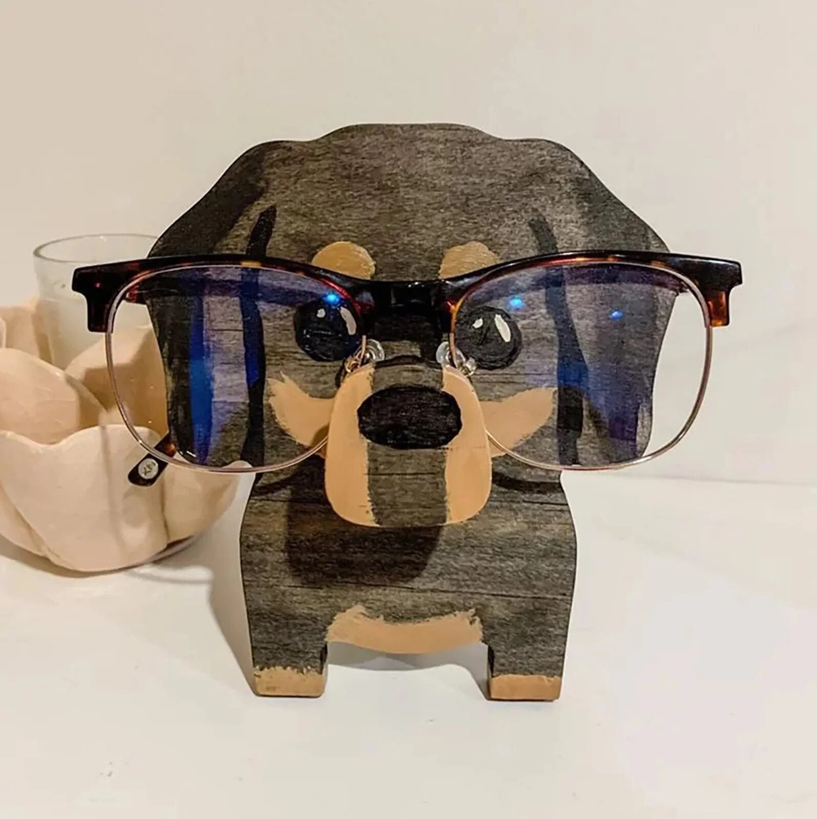 Charming animal eyeglass holder, a whimsical wooden spectacle stand for home or office.