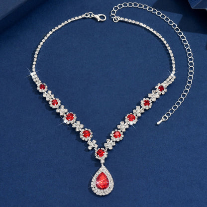 Close-up of sparkling waterdrop cubic zirconia pendant, dainty women's necklace.