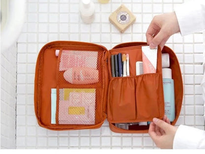Compact dark blue floral waterproof toiletry bag, ideal for travel & everyday cosmetic storage.