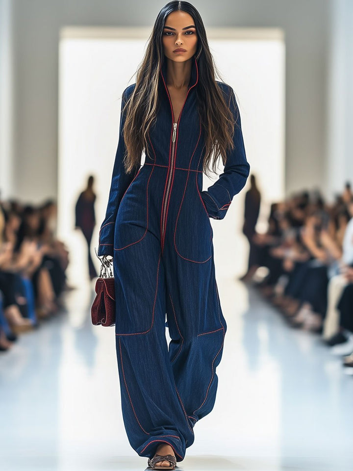 Women's dark blue wide leg jumpsuit with a stylish zip front, offering a modern and comfortable fit.