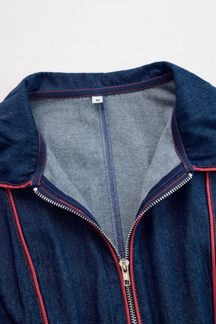 Full length view of a women's dark blue wide leg jumpsuit, a chic and comfortable outfit with a zip front.