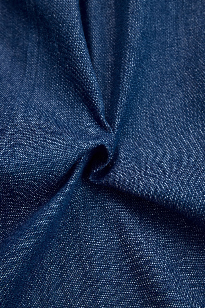 Modern dark blue wide leg jumpsuit for women, designed with a zip front for chic style & comfort wear.