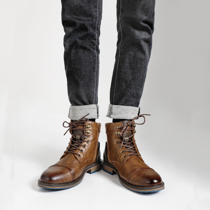 Close-up: Men's Bayshore dark brown side-zip boot, highlighting durable leather & rugged texture.