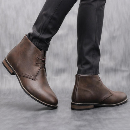 Stylish men's dark brown leather ankle boots, perfect for casual footwear with a rugged finish.