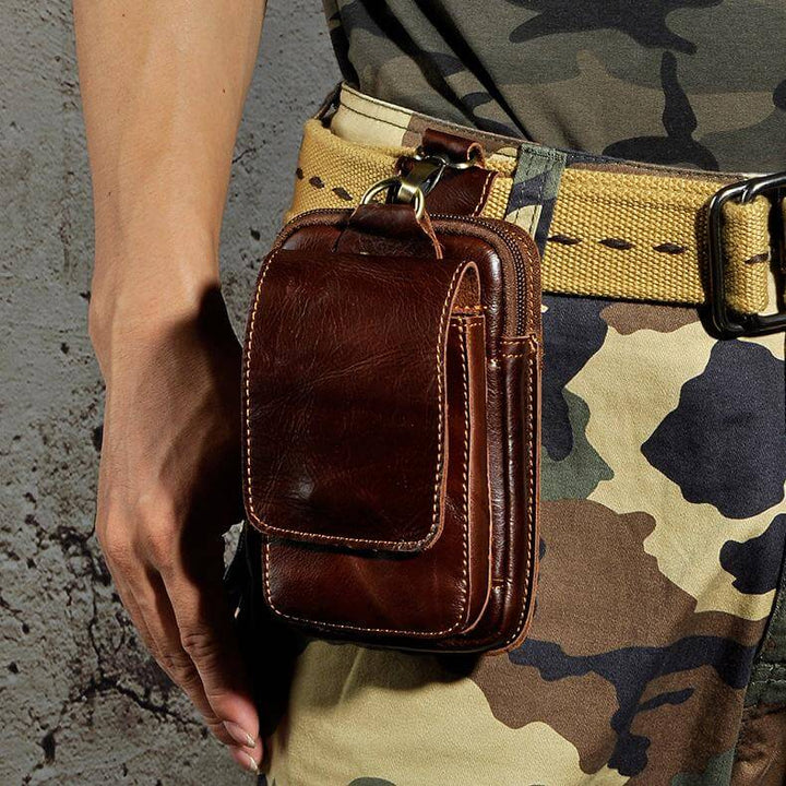 Spacious dark brown men's utility waist bag, perfect for storing everyday essentials and travel gear.