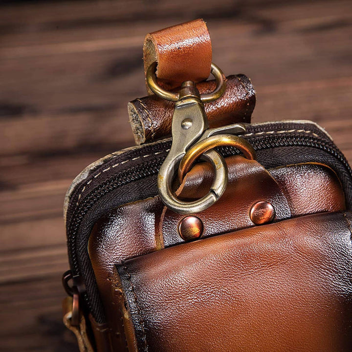 Men's dark brown travel waist bag, secure storage for essentials, also a chic crossbody hip pack.
