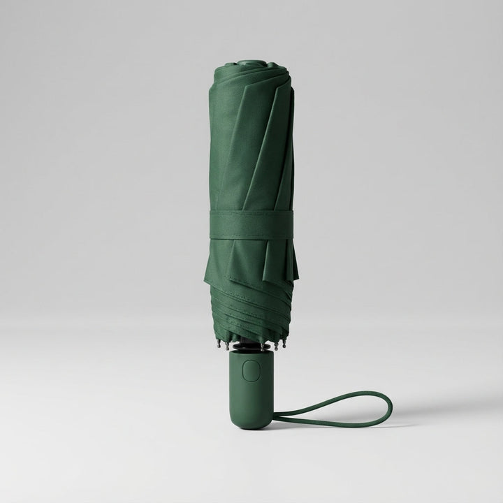 Ultra-compact dark green pocket umbrella. Lightweight, portable, ideal for travel & UV protection.