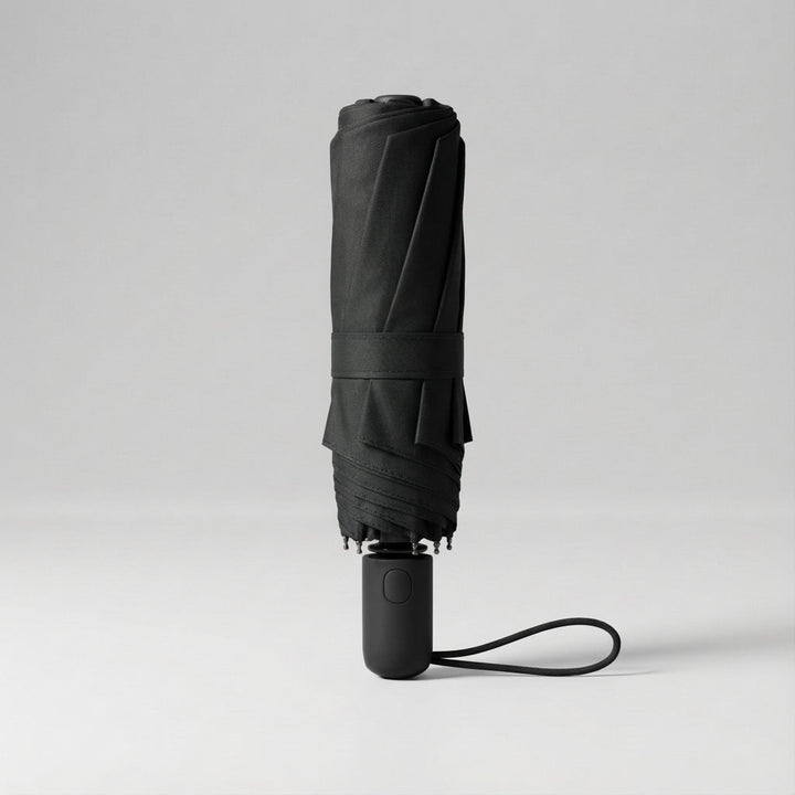 Dark green compact travel sun umbrella. Lightweight, portable, with effective UV protection.