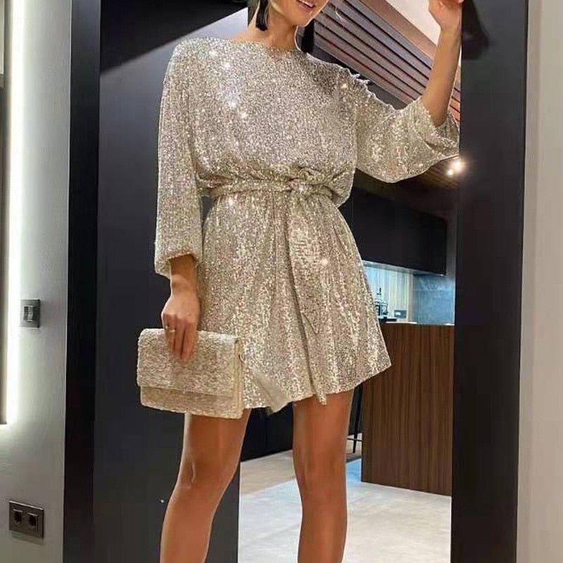 Elegant women's sequin mini dress with dazzling shimmer; stylish evening wear for special occasions.