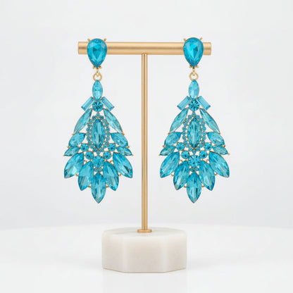 Dazzling white crystal drop earrings, elegant women's dangle jewelry, sparkling fashion accessory.