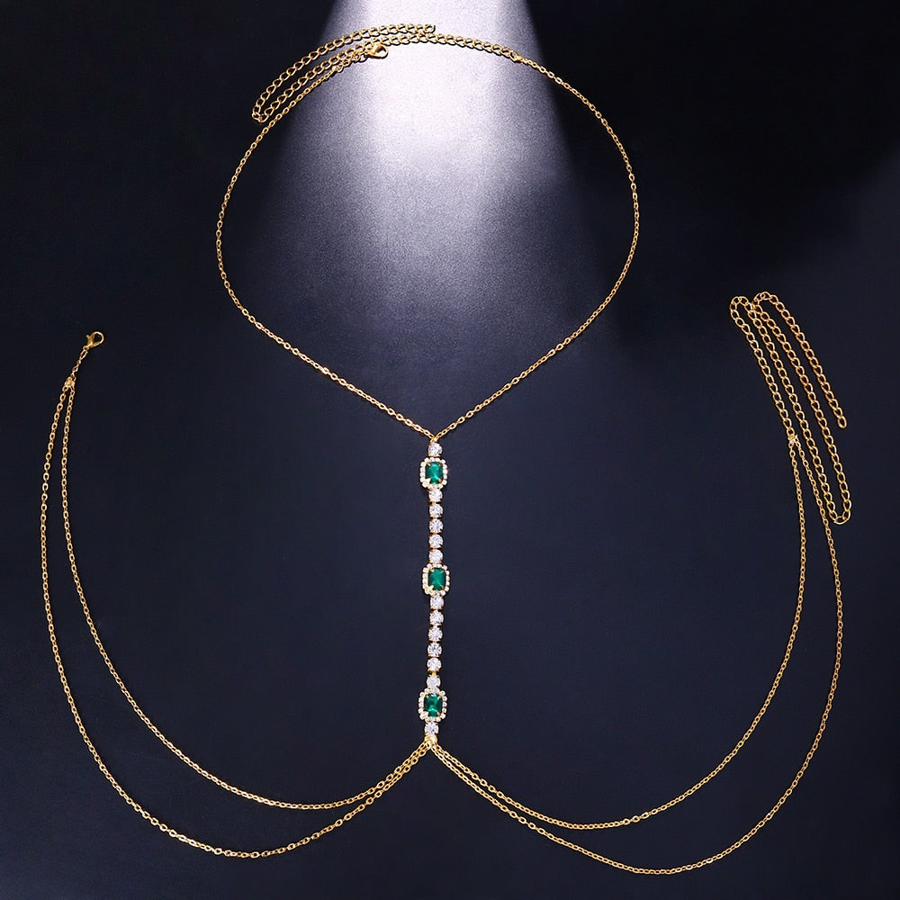 Women's dazzling green crystal chest chain. Eye-catching rhinestone body jewelry, ideal for festival fashion & statements.