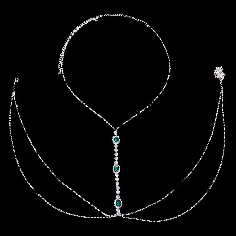 Sparkling women's green crystal chest chain. Festival-ready rhinestone body jewelry, a dazzling and elegant statement.