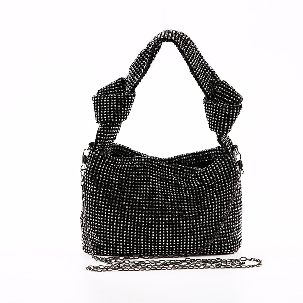 Sparkly women's metallic rhinestone handbag, a glamorous accessory for evening events.