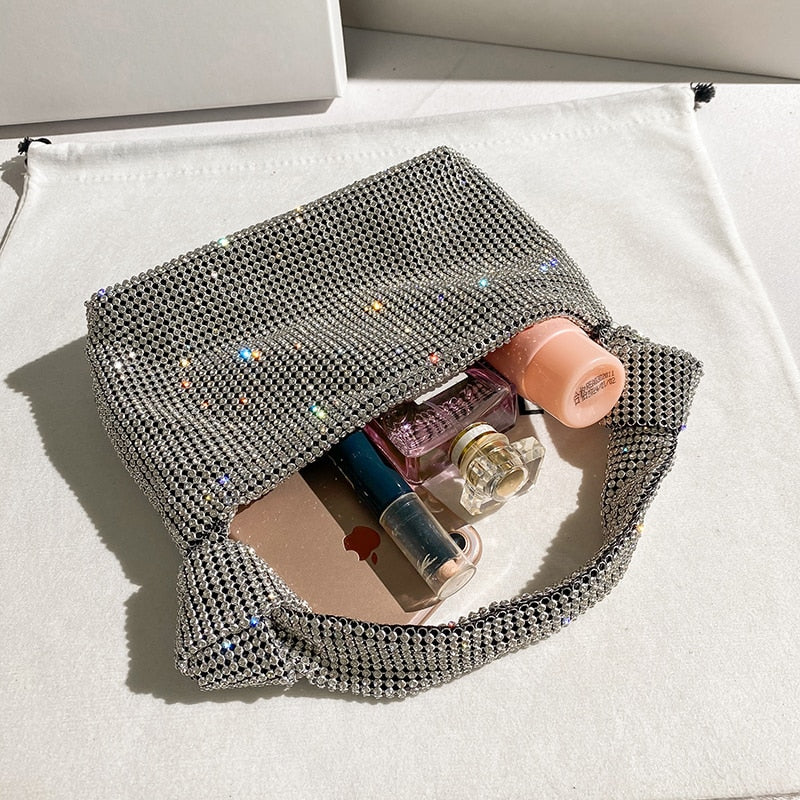 Gold rhinestone evening clutch, a sophisticated sparkly bag for women's special occasions.