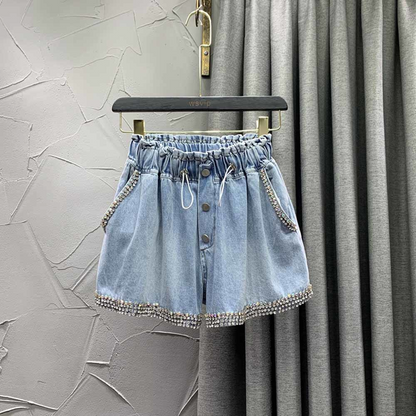 Glamorous women's evening shorts with dazzling rhinestones. Chic high-waist design for sparkling party fashion.
