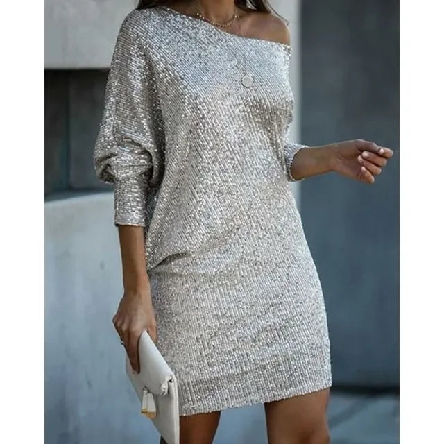 Shimmering women's sequin mini dress with a glittery finish. Elegant and dazzling for evening or party wear.
