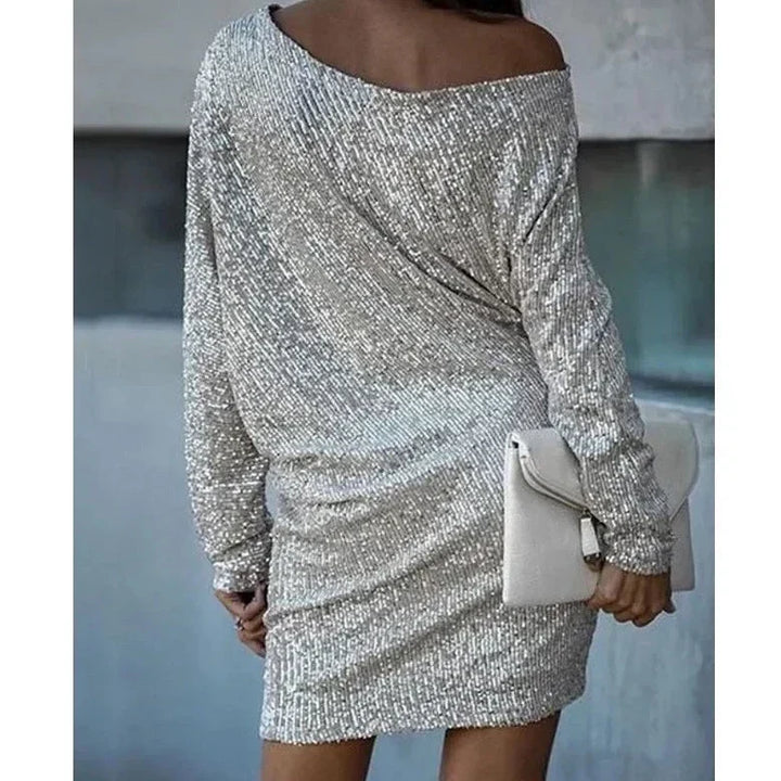 Stunning women's sequin party dress. This glamorous mini evening dress offers a dazzling, glittery look.