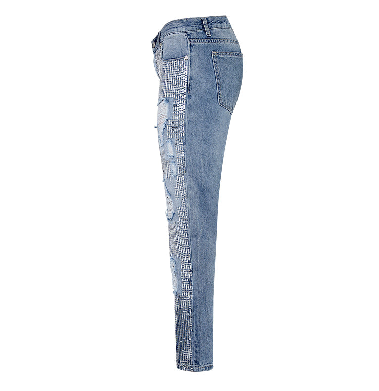 Sparkling women's distressed jeans with sequin embellishments. Trendy ripped style for a dazzling and comfortable fashion statement.