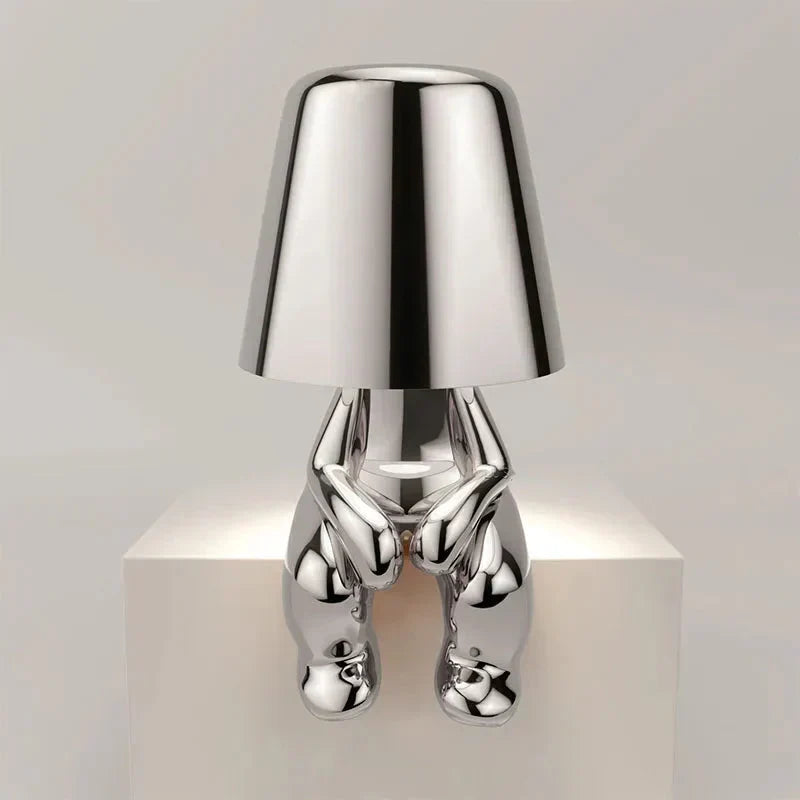 Contemporary LED table lamp, unique design, provides soft ambient light.
