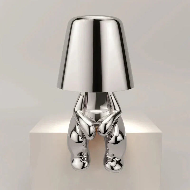 Contemporary LED table lamp, unique design, provides soft ambient light.