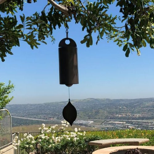 Zen-inspired deep resonance serenity bell, a tranquil metal art chime for peaceful outdoor home decor.