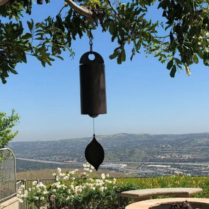 Zen-inspired deep resonance serenity bell, a tranquil metal art chime for peaceful outdoor home decor.