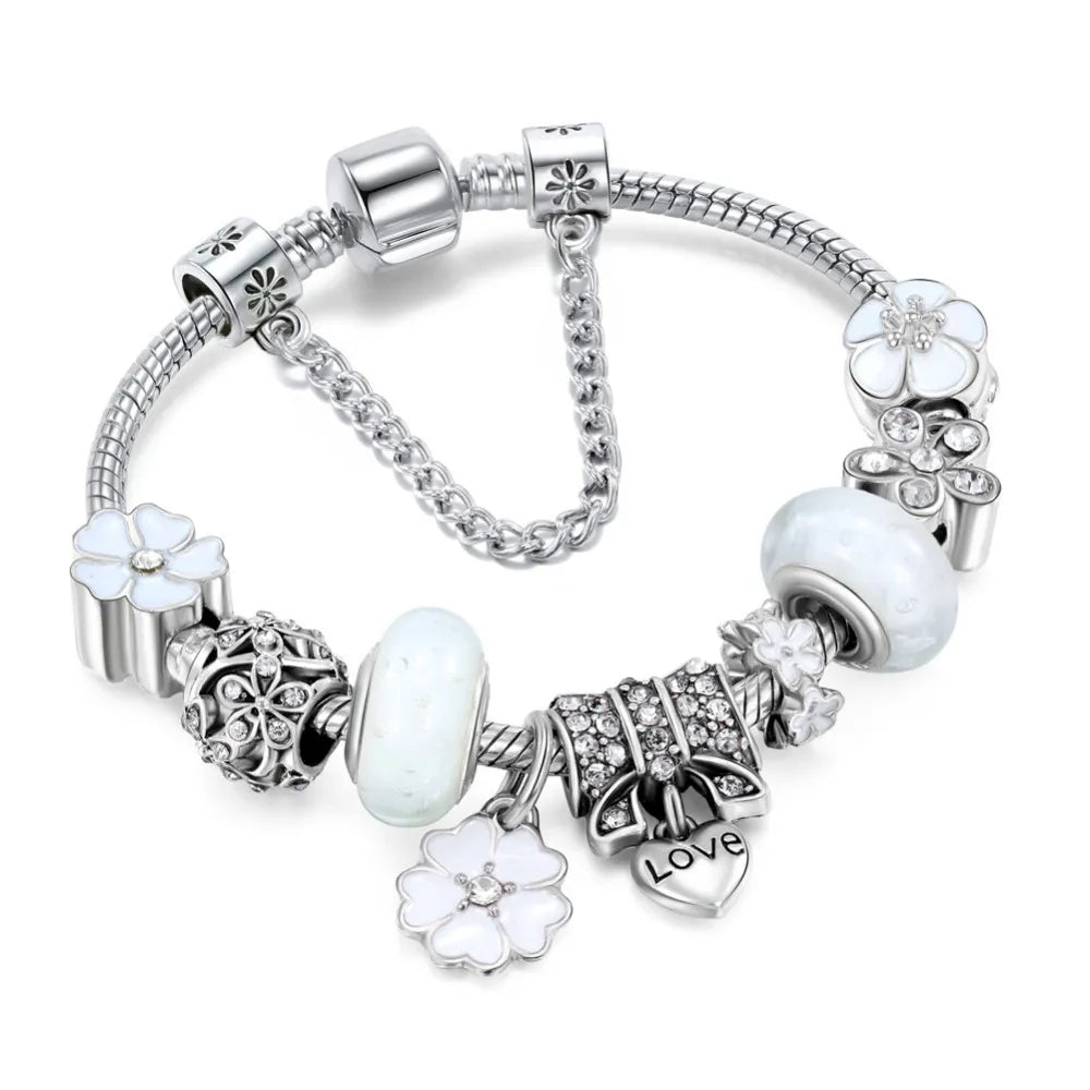 Stylish women's peach blossom charm bracelet, a delicate stainless steel floral jewelry piece. Perfect for gifts.