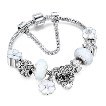 Stylish women's peach blossom charm bracelet, a delicate stainless steel floral jewelry piece. Perfect for gifts.