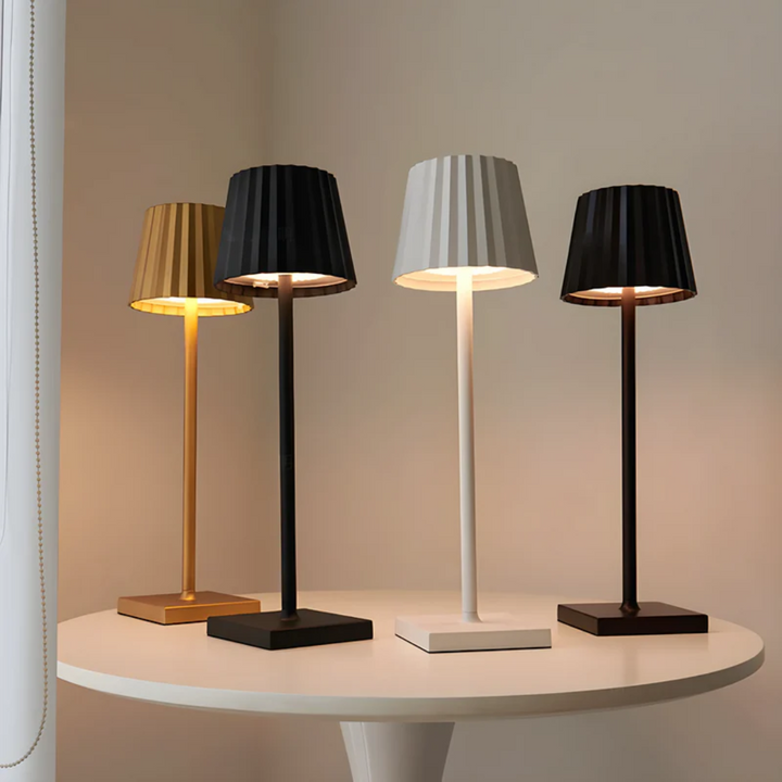 Elegant dimmable touch lamp, a portable LED lighting solution for modern home and office environments.