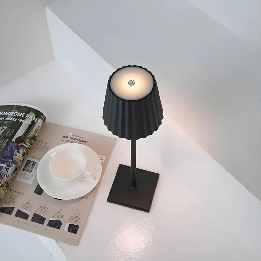Touch-controlled dimmable LED table lamp, perfect for ambient lighting in any modern home or office.