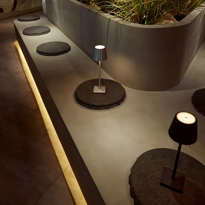 Wireless LED table lamp with touch dimmer, perfect for a clean, modern home or office setup.