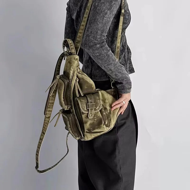 Modern women's convertible backpack with a distressed vintage look, great as a sling or travel bag.