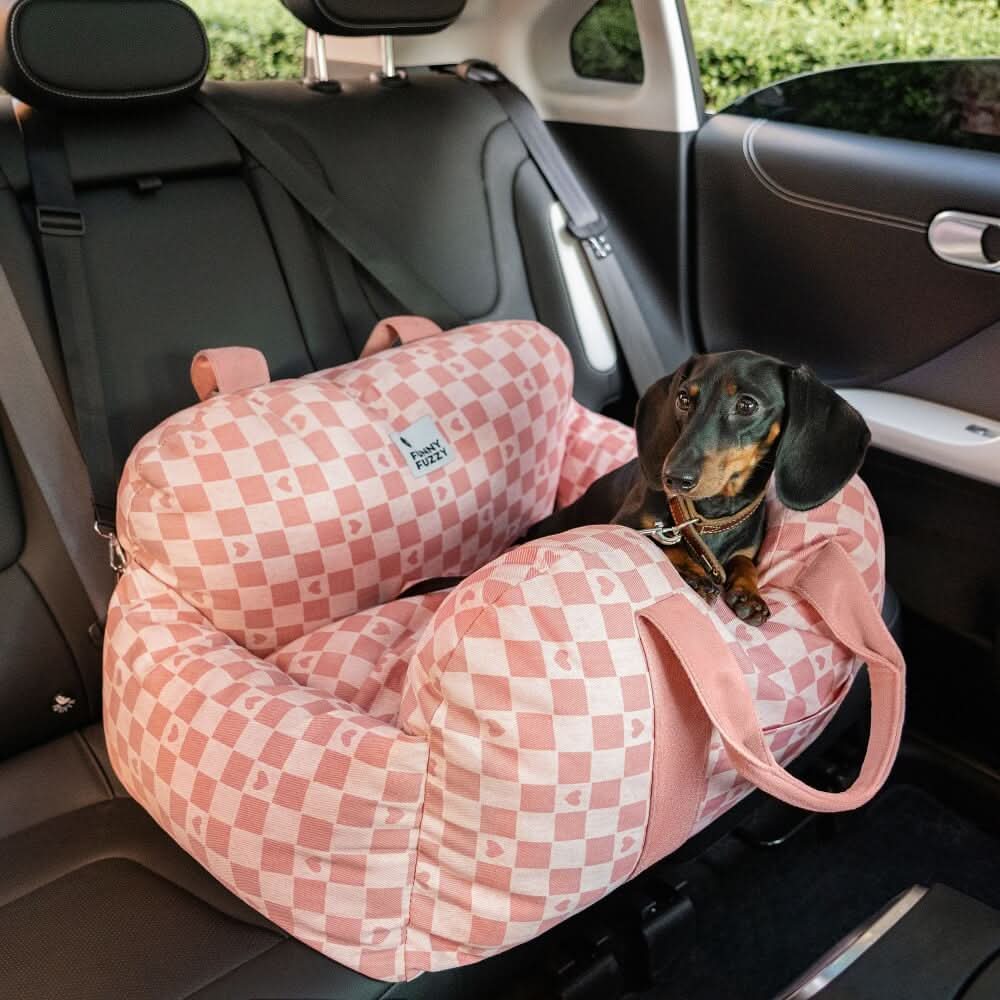 Plush and comfortable dog booster car seat, ensuring a cozy and safe ride with its safety belt.