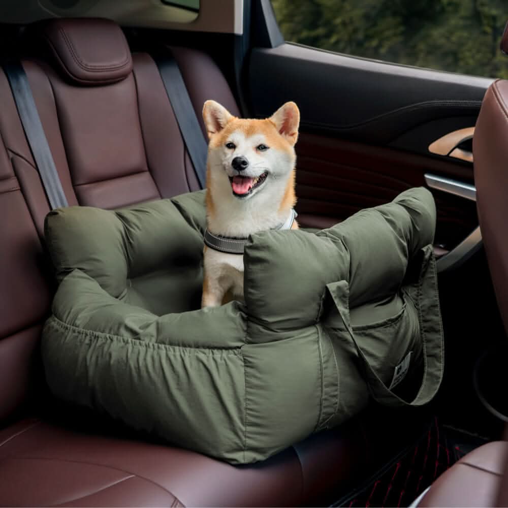 Dog booster car seat showing its robust safety belt attachment and padded, washable interior.