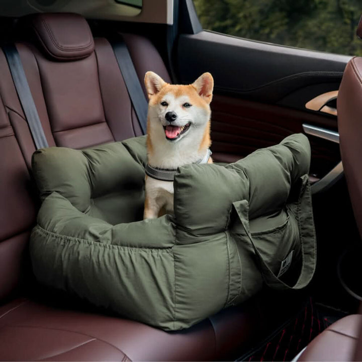 Dog booster car seat showing its robust safety belt attachment and padded, washable interior.