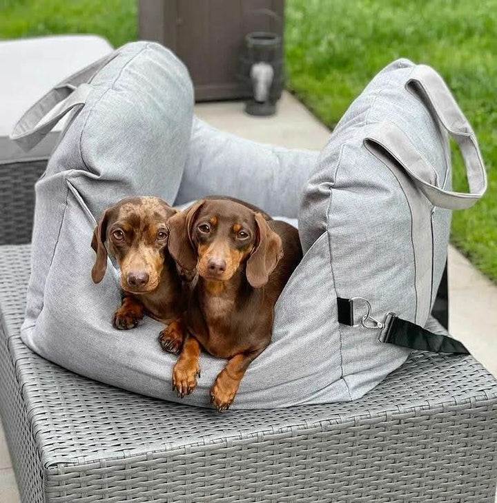 Portable pet travel booster seat for dogs. Easy to install, features a safety belt & comfy washable bed.