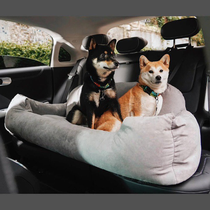 PawsRest secure dog travel bed in a car back seat. Provides comfort & safety for pets during road trips.
