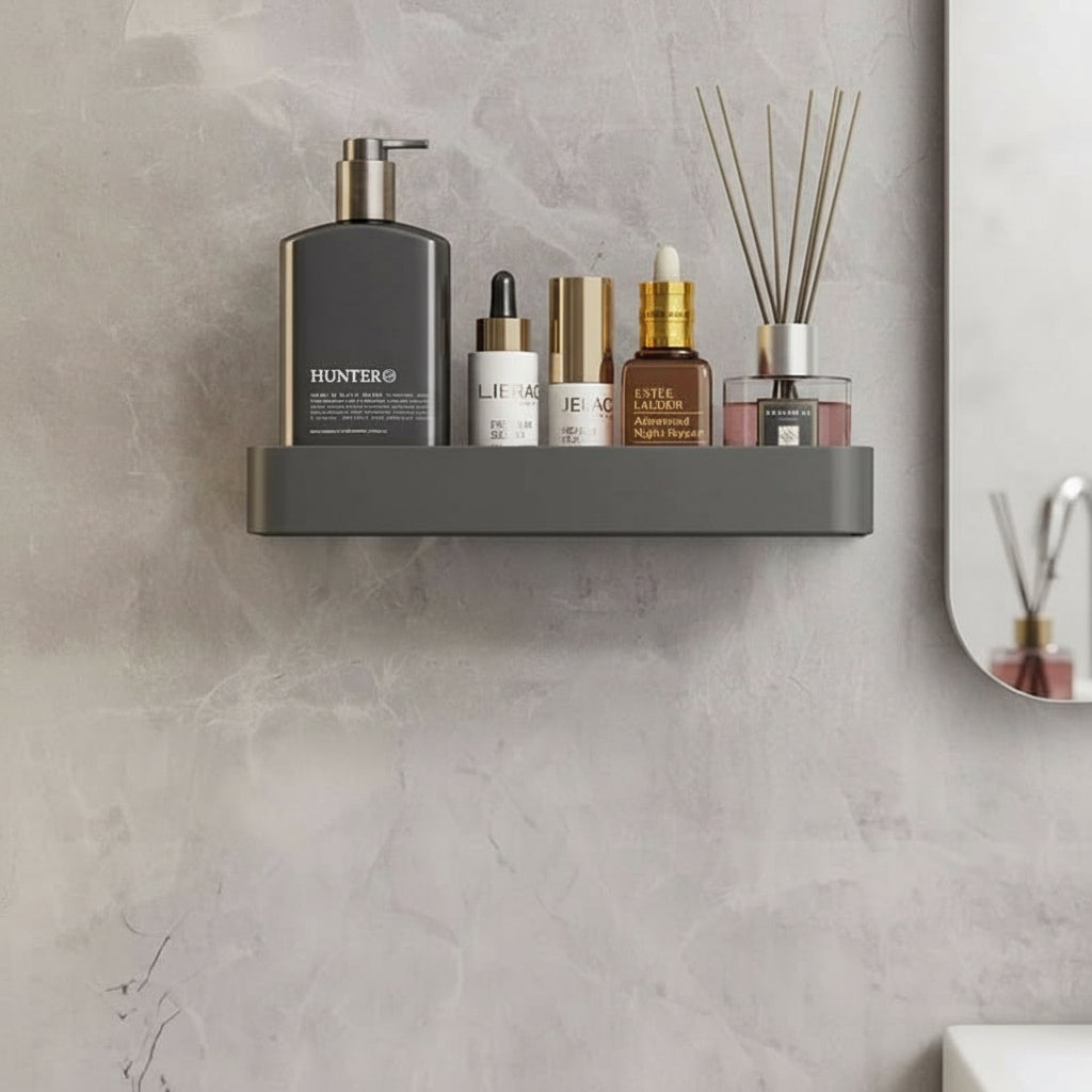 Drill-free bathroom organizer shelf with integrated towel bar. Modern wall-mounted storage for toiletries.
