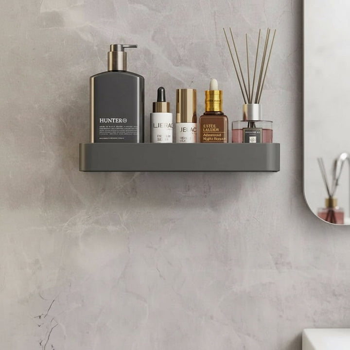 Drill-free bathroom organizer shelf with integrated towel bar. Modern wall-mounted storage for toiletries.