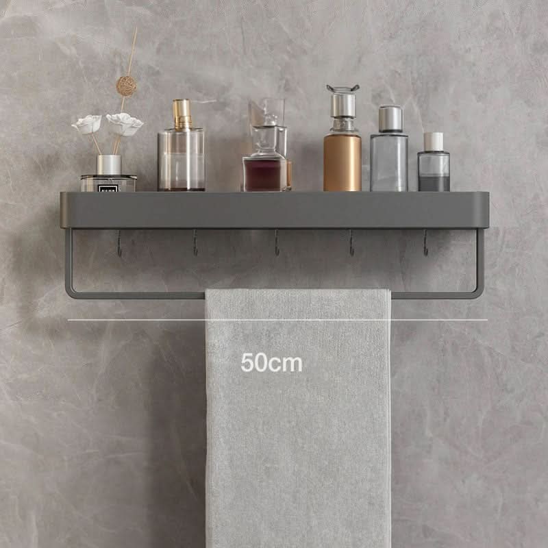 Versatile drill-free bathroom storage shelf & towel rail. Keeps toiletries neat and accessible on walls.