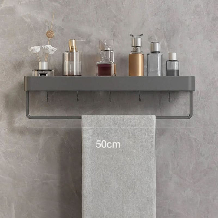 Versatile drill-free bathroom storage shelf & towel rail. Keeps toiletries neat and accessible on walls.