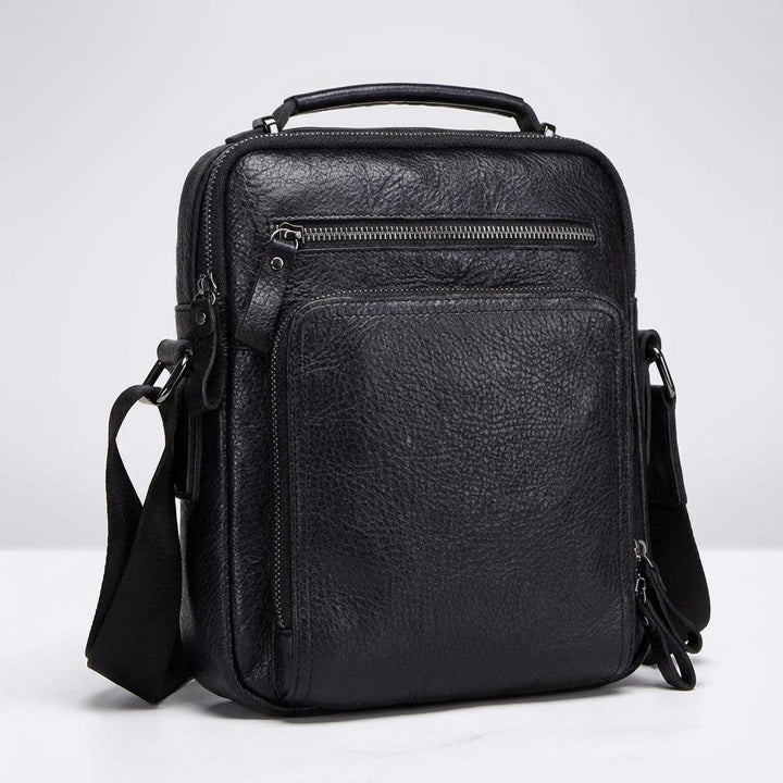 Compact leather shoulder bag, ideal for student use & daily essentials. Durable unisex design for work & travel.