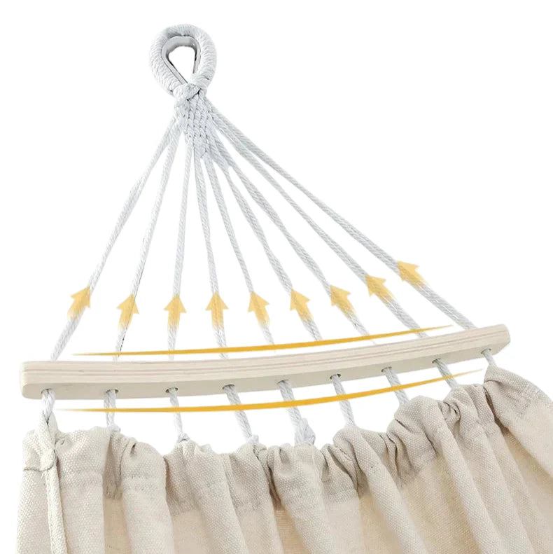 Relax in style with this anti-rollover canvas hammock, featuring spreader bars, ideal for any outdoor setting