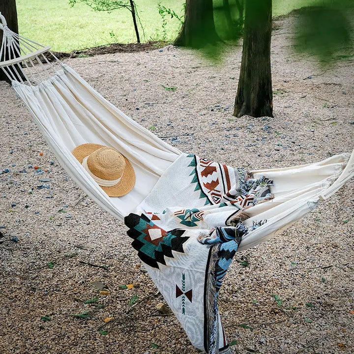 Premium canvas hammock with spreader bars for enhanced stability, a must-have for outdoor relaxation and camping