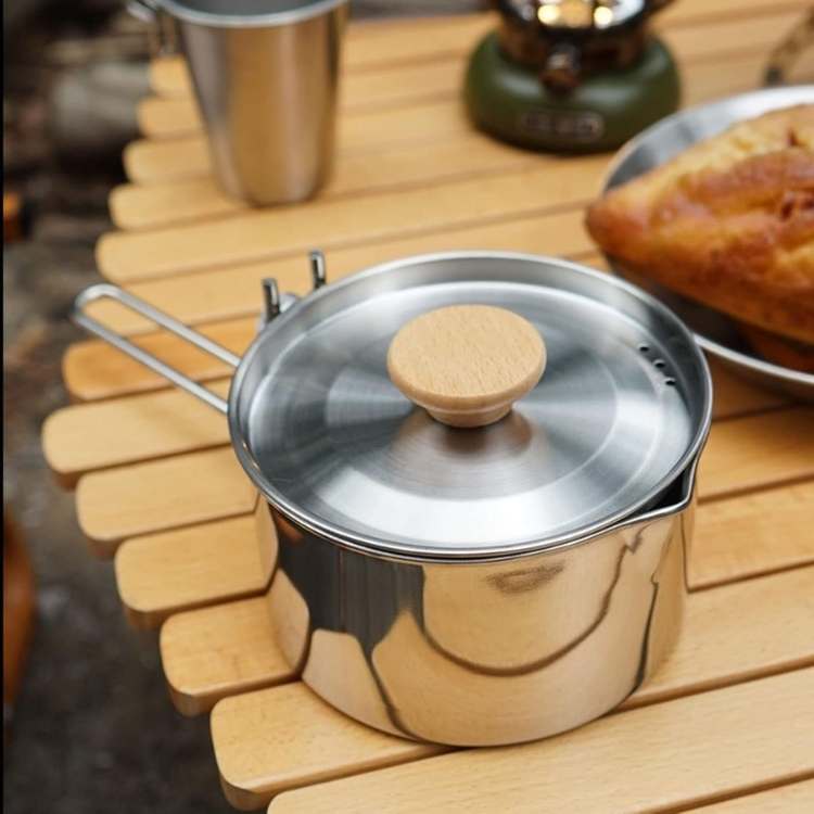 Robust stainless steel kettle, essential camp kitchen gear for camping and outdoor boiling.