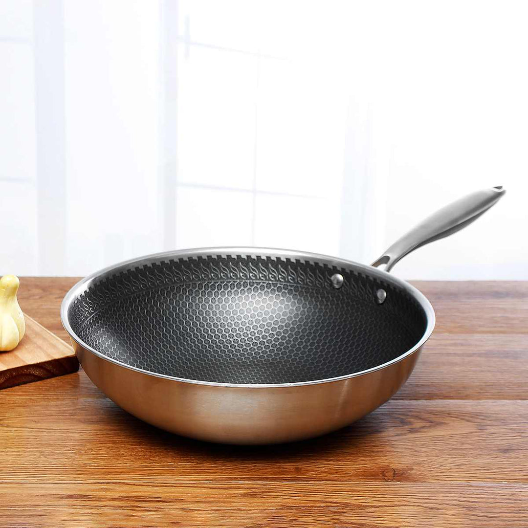 Durable stainless steel non-stick frying pan for effortless cooking and easy food release, perfect for any kitchen.