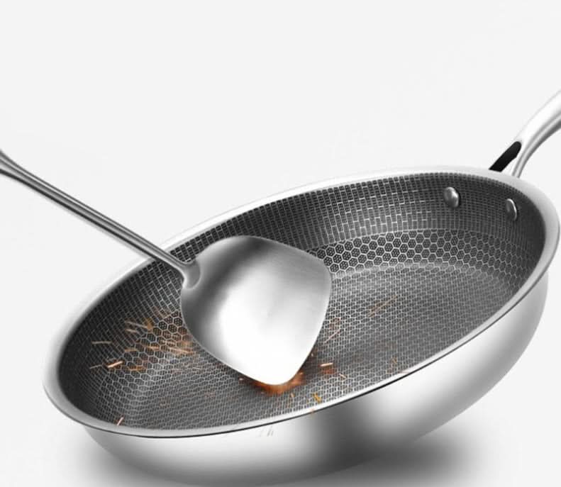 Sleek stainless steel non-stick frying pan, engineered for durability and effortless cooking, a kitchen essential.